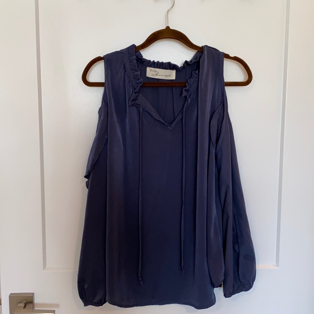 Bluish/purple long sleeve cold shoulder top.